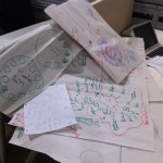 a pile of flip chart sheets that were the basis of the original application