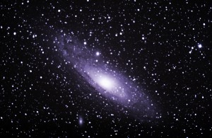 a photo of space - specifically the Big Andromeda galaxy - lots of stars shining in a black background.