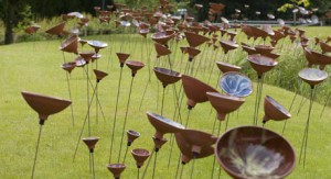 A field of ceramic flowers
