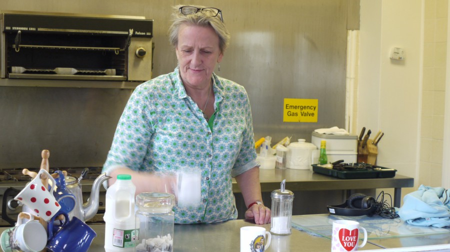 Bobby in the kitchen of a community centre making tea
