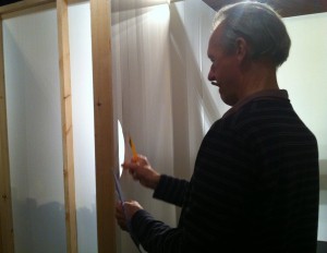Richard working on the house - cutting a new hand hole