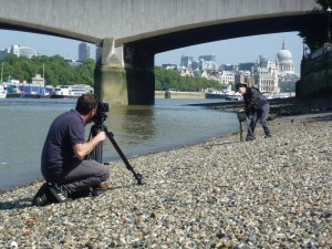 jez winding his siren on the beach being filmed with st pauls in the background